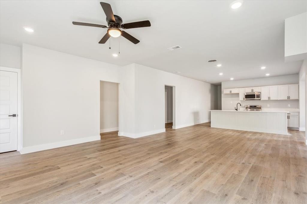900 North 22nd Street Waco, TX 76707 - Photo 9 of 37 a view of kitchen with wooden floor and window
