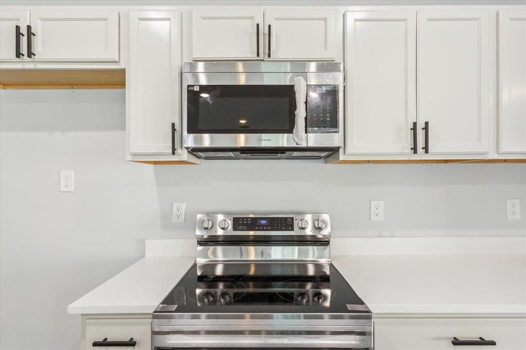 900 North 22nd Street Waco, TX 76707 - Photo 10 of 37 a stove top oven sitting inside of a kitchen