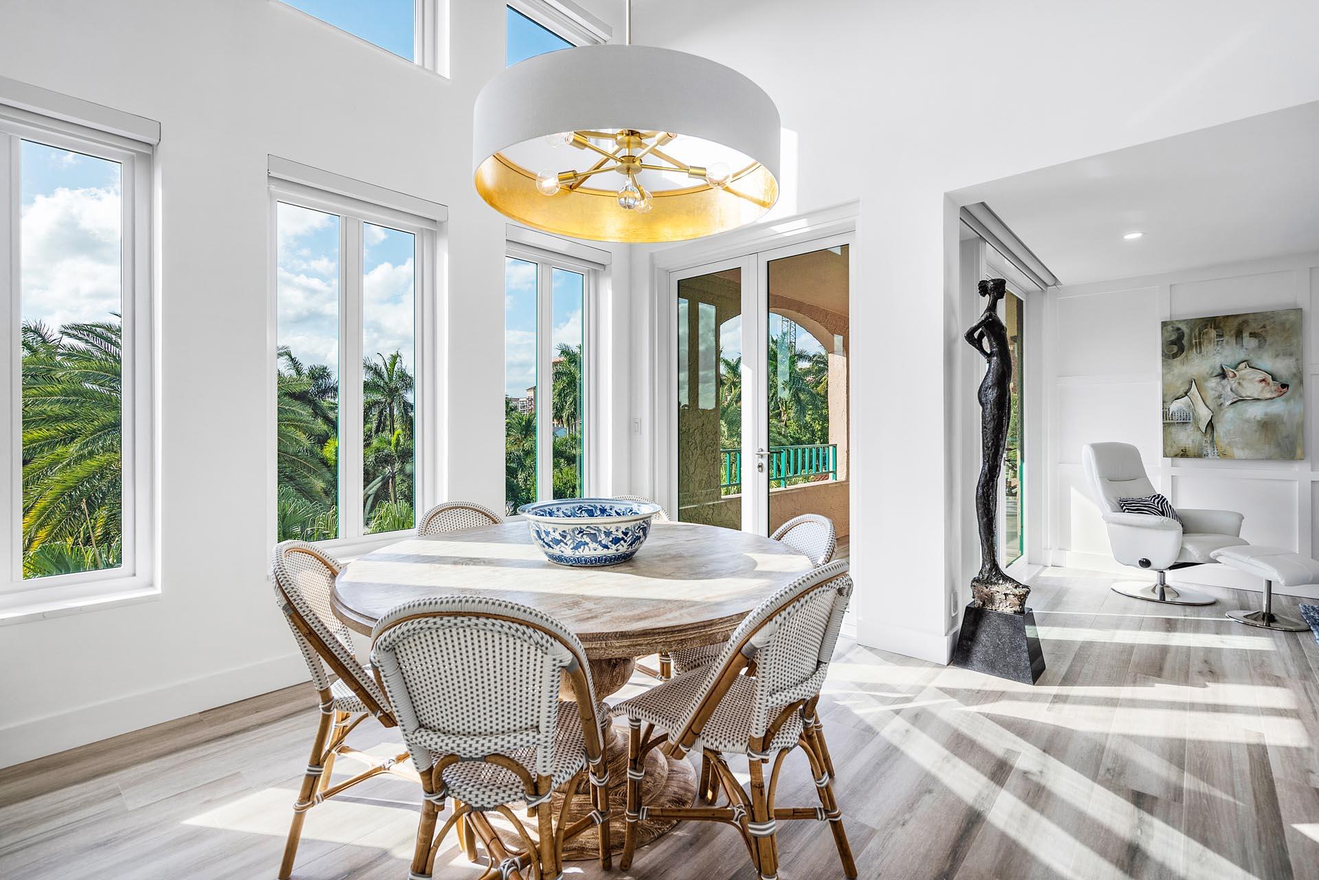 100 Southeast 5th Avenue, Unit 416 Boca Raton, FL 33432 - Photo 12 of 42 a view of a dining room with furniture and a large window