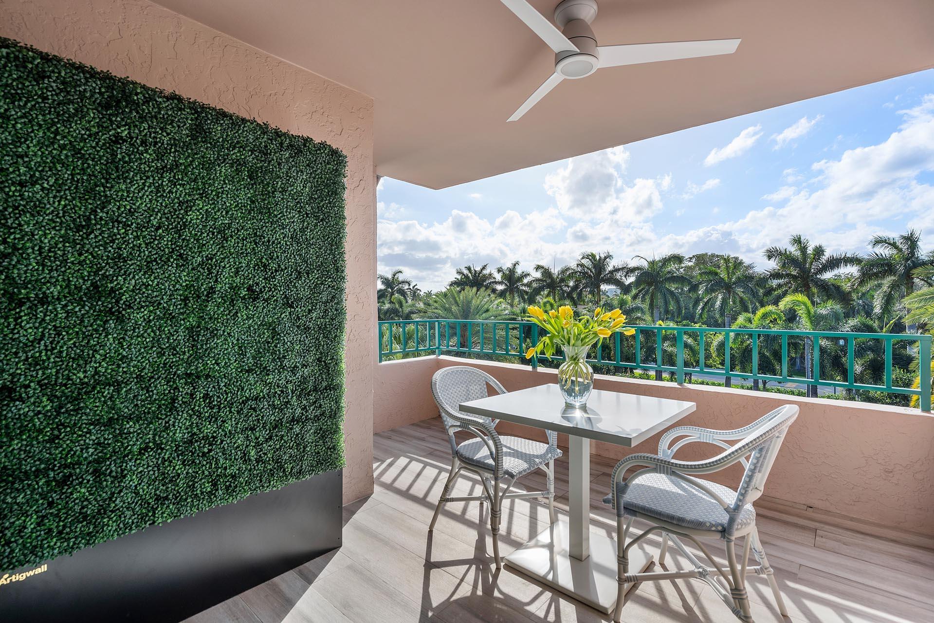 100 Southeast 5th Avenue, Unit 416 Boca Raton, FL 33432 - Photo 13 of 42 a view of a patio with a table chairs and a backyard