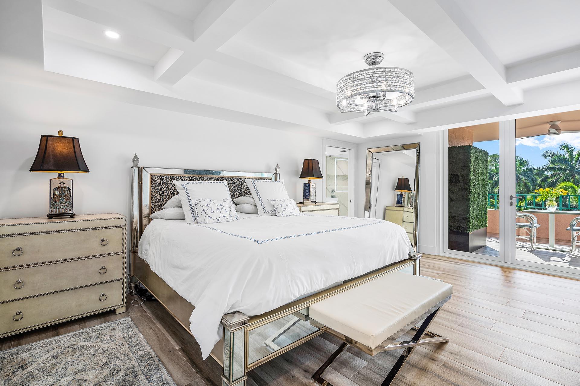 100 Southeast 5th Avenue, Unit 416 Boca Raton, FL 33432 - Photo 15 of 42 a bedroom with a bed and wooden floor