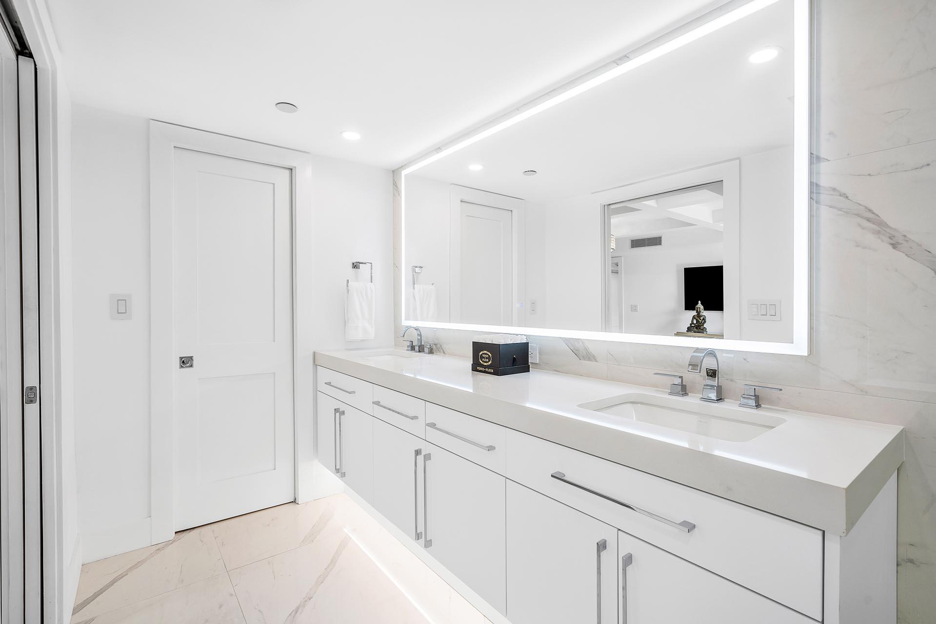 100 Southeast 5th Avenue, Unit 416 Boca Raton, FL 33432 - Photo 18 of 42 a bathroom with a sink and a mirror