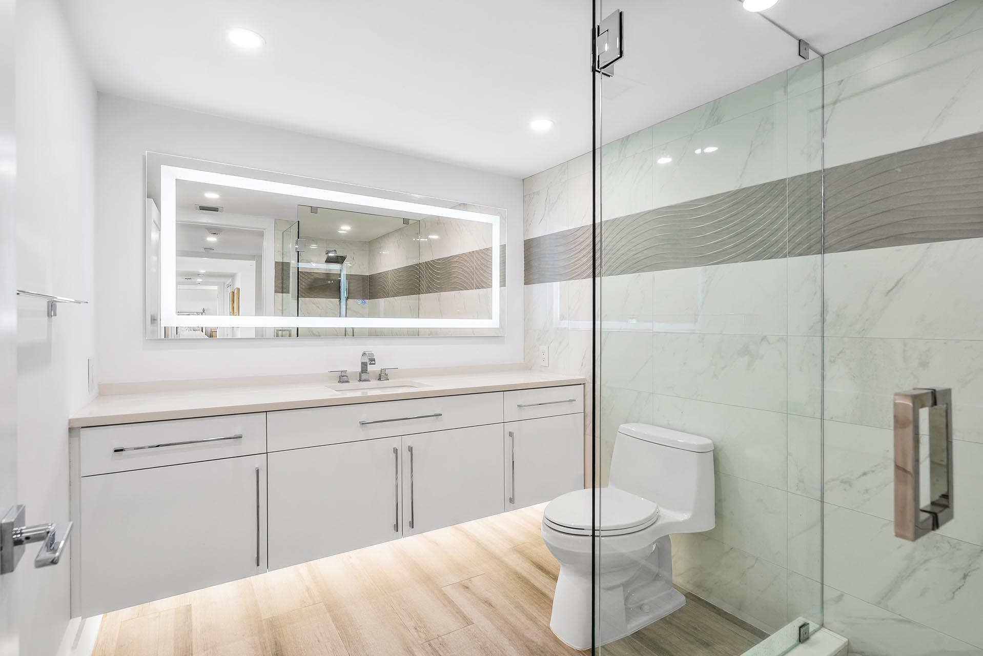 100 Southeast 5th Avenue, Unit 416 Boca Raton, FL 33432 - Photo 27 of 42 a spacious bathroom with a double vanity sink a mirror and a shower