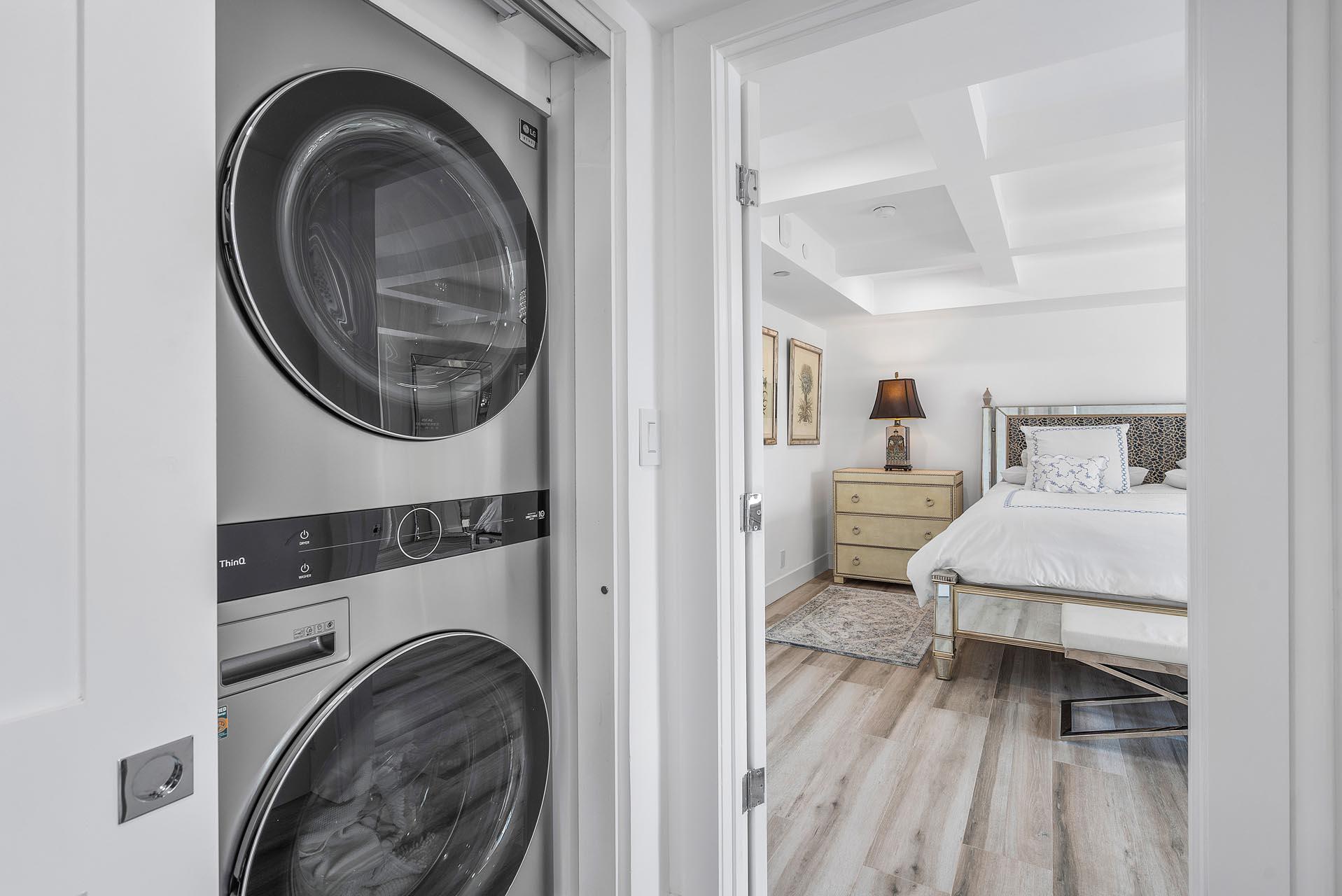 100 Southeast 5th Avenue, Unit 416 Boca Raton, FL 33432 - Photo 28 of 42 a view of a bedroom with washer and dryer