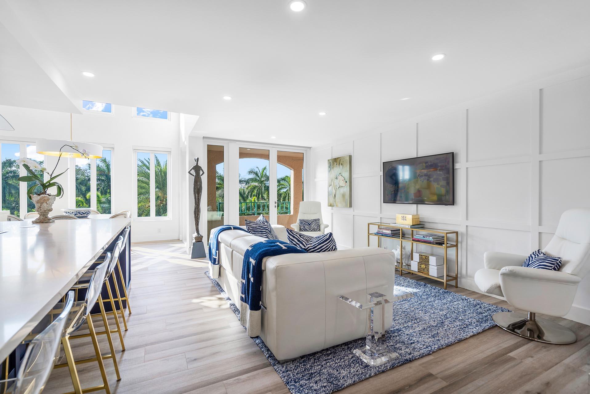 100 Southeast 5th Avenue, Unit 416 Boca Raton, FL 33432 - Photo 4 of 42 a living room with furniture wooden floor and a flat screen tv