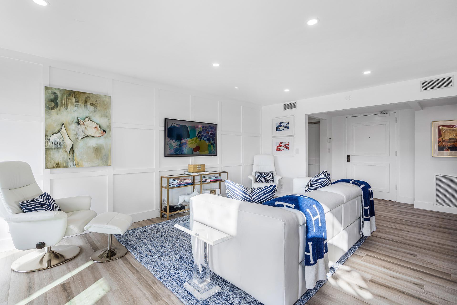 100 Southeast 5th Avenue, Unit 416 Boca Raton, FL 33432 - Photo 5 of 42 a living room with furniture and a flat screen tv