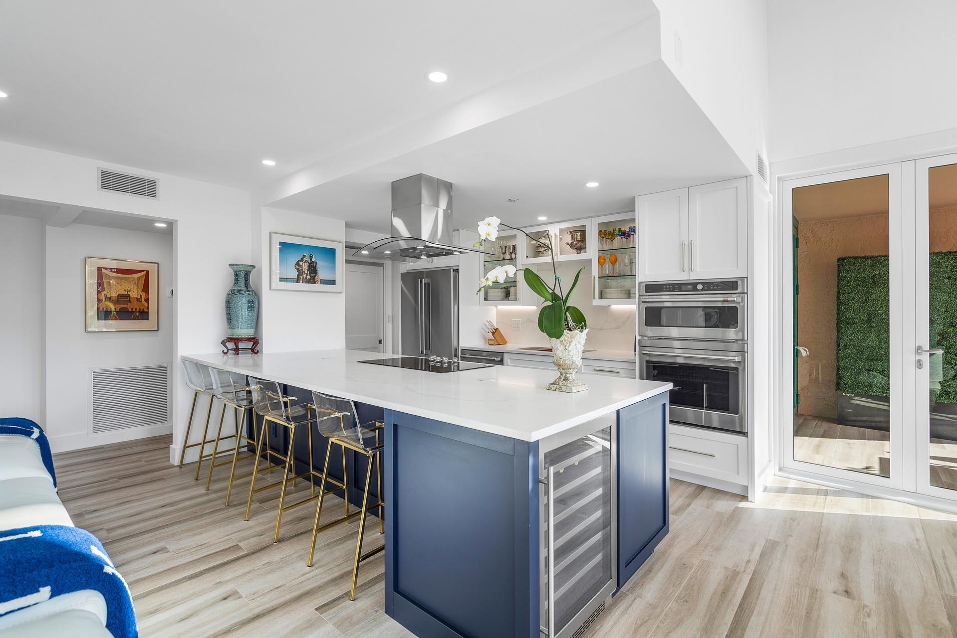 100 Southeast 5th Avenue, Unit 416 Boca Raton, FL 33432 - Photo 7 of 42 a kitchen with kitchen island stainless steel appliances a sink and counter space