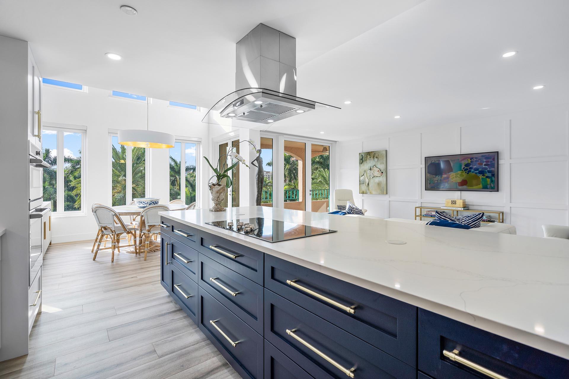 100 Southeast 5th Avenue, Unit 416 Boca Raton, FL 33432 - Photo 8 of 42 a kitchen with stainless steel appliances granite countertop a lot of counter space and wooden floors