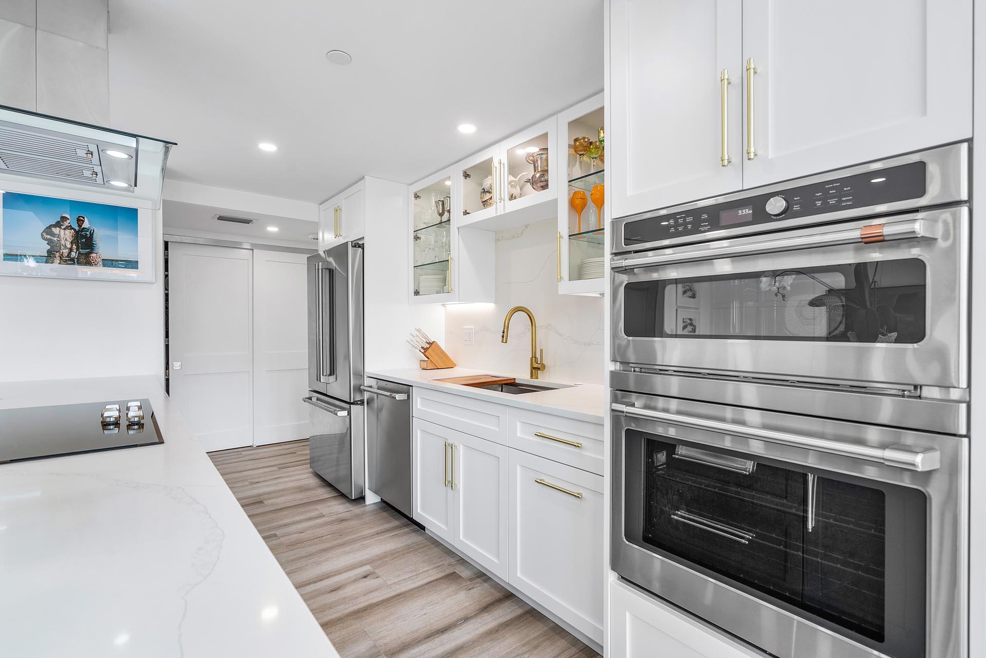 100 Southeast 5th Avenue, Unit 416 Boca Raton, FL 33432 - Photo 9 of 42 a kitchen with cabinets and stainless steel appliances