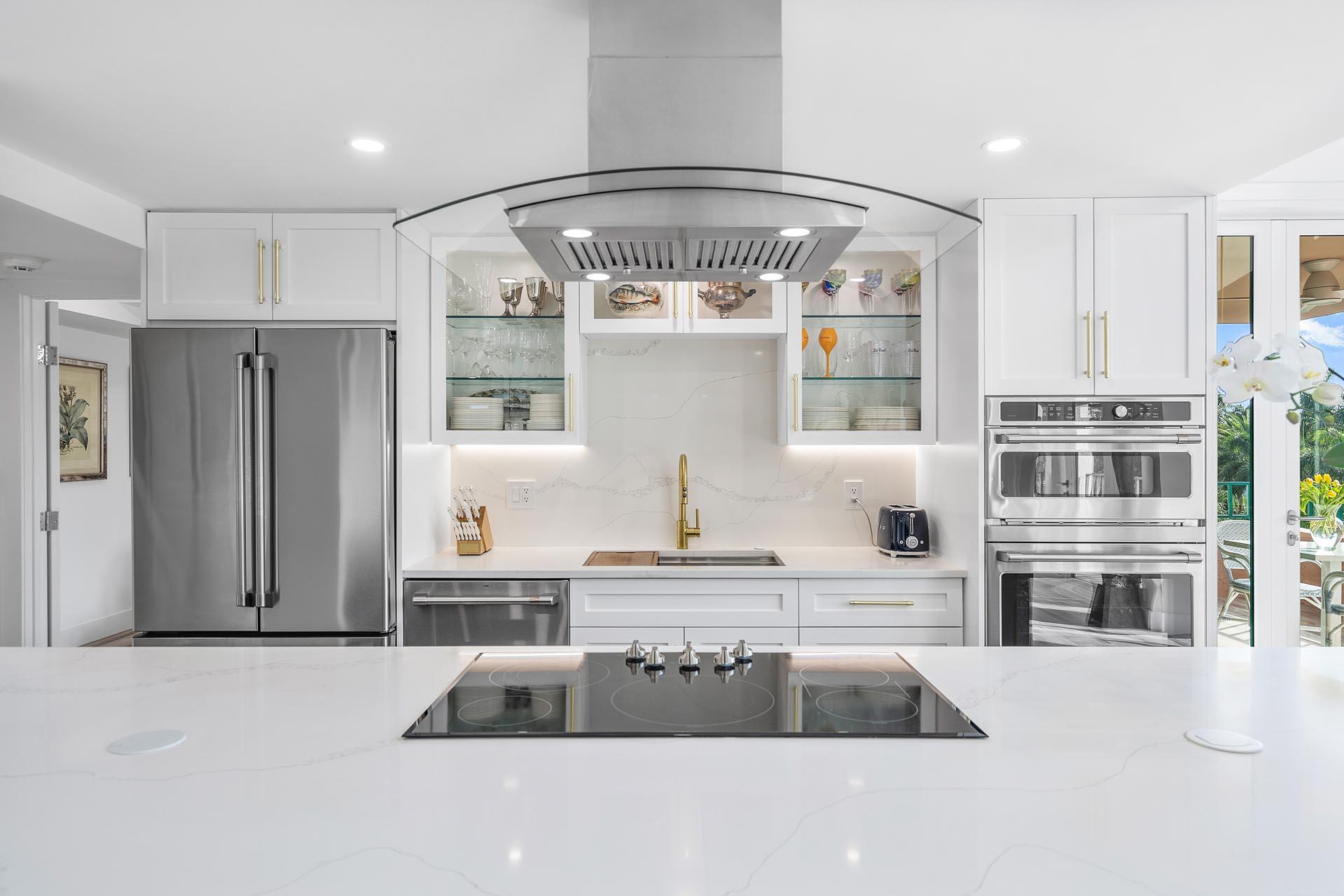 100 Southeast 5th Avenue, Unit 416 Boca Raton, FL 33432 - Photo 10 of 42 a kitchen with stainless steel appliances granite countertop a refrigerator and a stove top oven