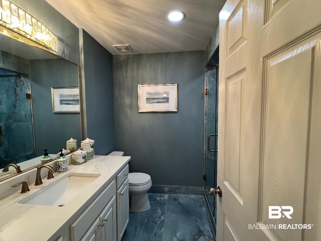 27580 Canal Road, Unit 1210 Orange Beach, AL 36561 - Photo 21 of 28 Full bathroom with vanity, a stall shower, recessed lighting, and dark marble finish floors