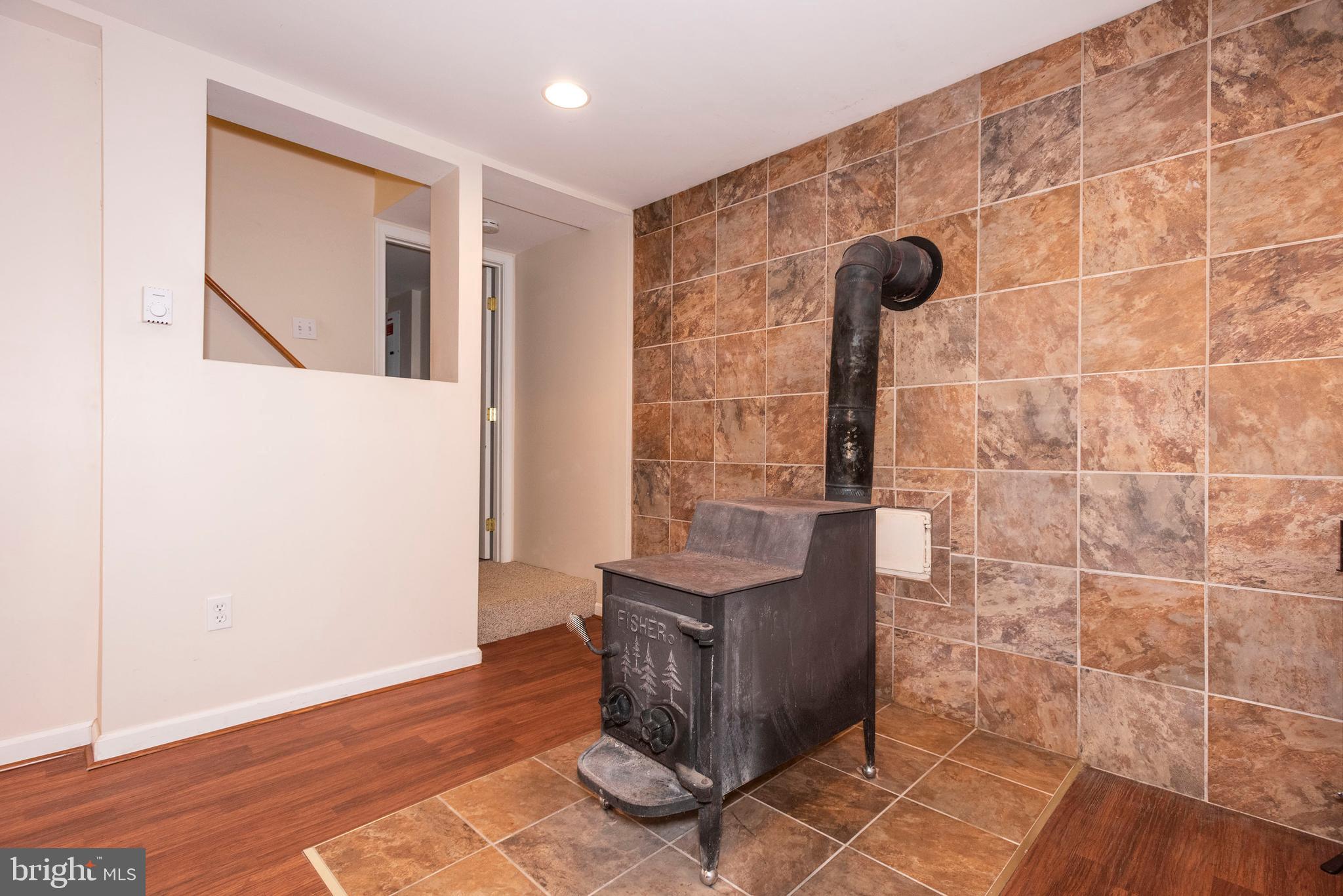 10527 Rum Springs Road Frederick, MD 21702 - Photo 23 of 39 Lower Level Rec Room w/ Wood Burning Stove