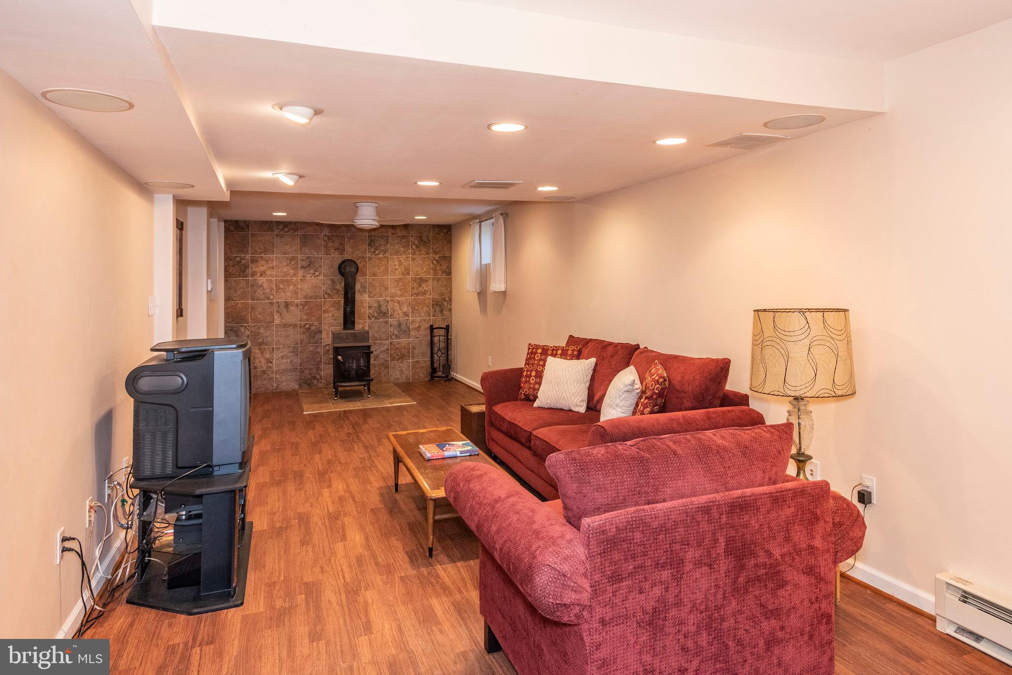 10527 Rum Springs Road Frederick, MD 21702 - Photo 25 of 39 Lower Level Rec Room w/ Wood Burning Stove