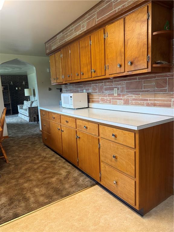 151 Huntingdon Road Wyano, PA 15695 - Photo 19 of 36 a kitchen with stainless steel appliances granite countertop a stove a sink and a microwave