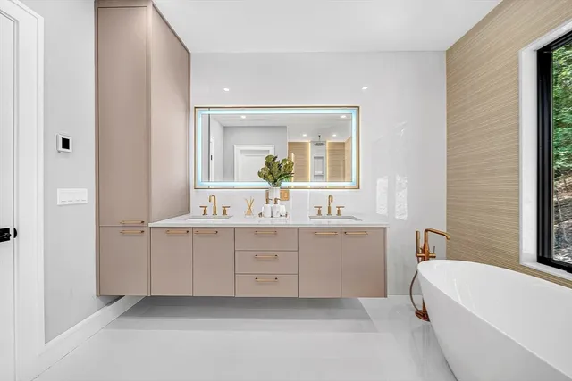 a bathroom with a bathtub and shower