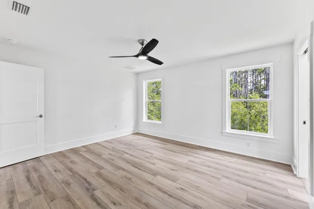 a view of a garden with a building in the background