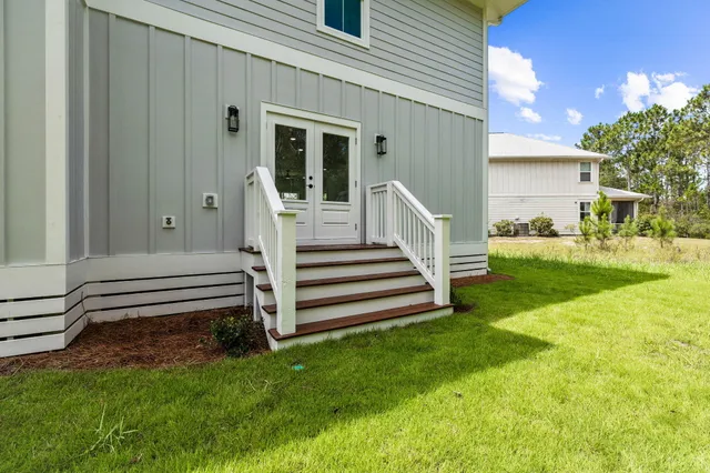 a swimming pool with outdoor seating and yard