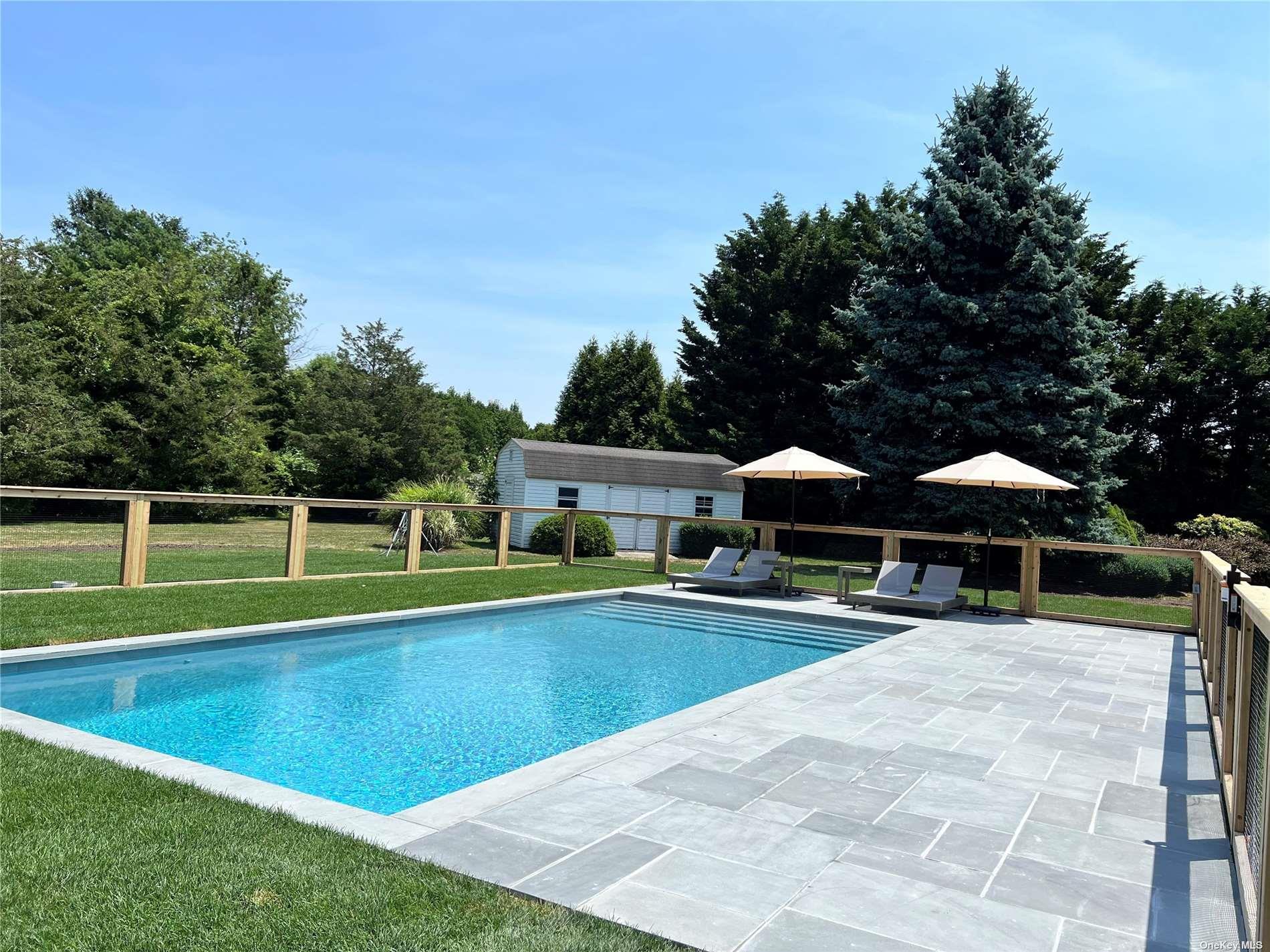 Undisclosed Address Mattituck, NY 11952 - Photo 1 of 35 a view of a house with a swimming pool