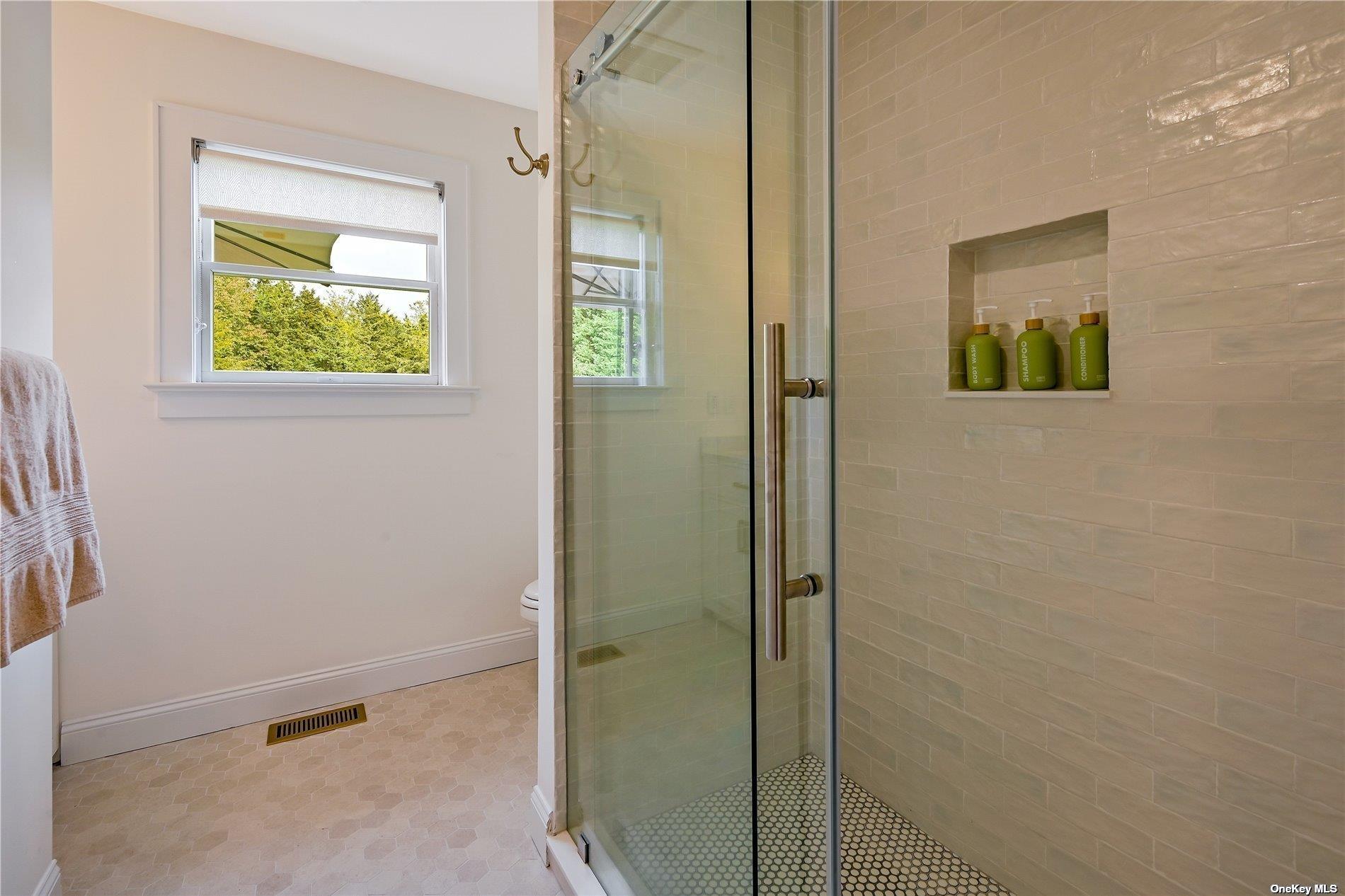 Undisclosed Address Mattituck, NY 11952 - Photo 13 of 35 a bathroom with a window