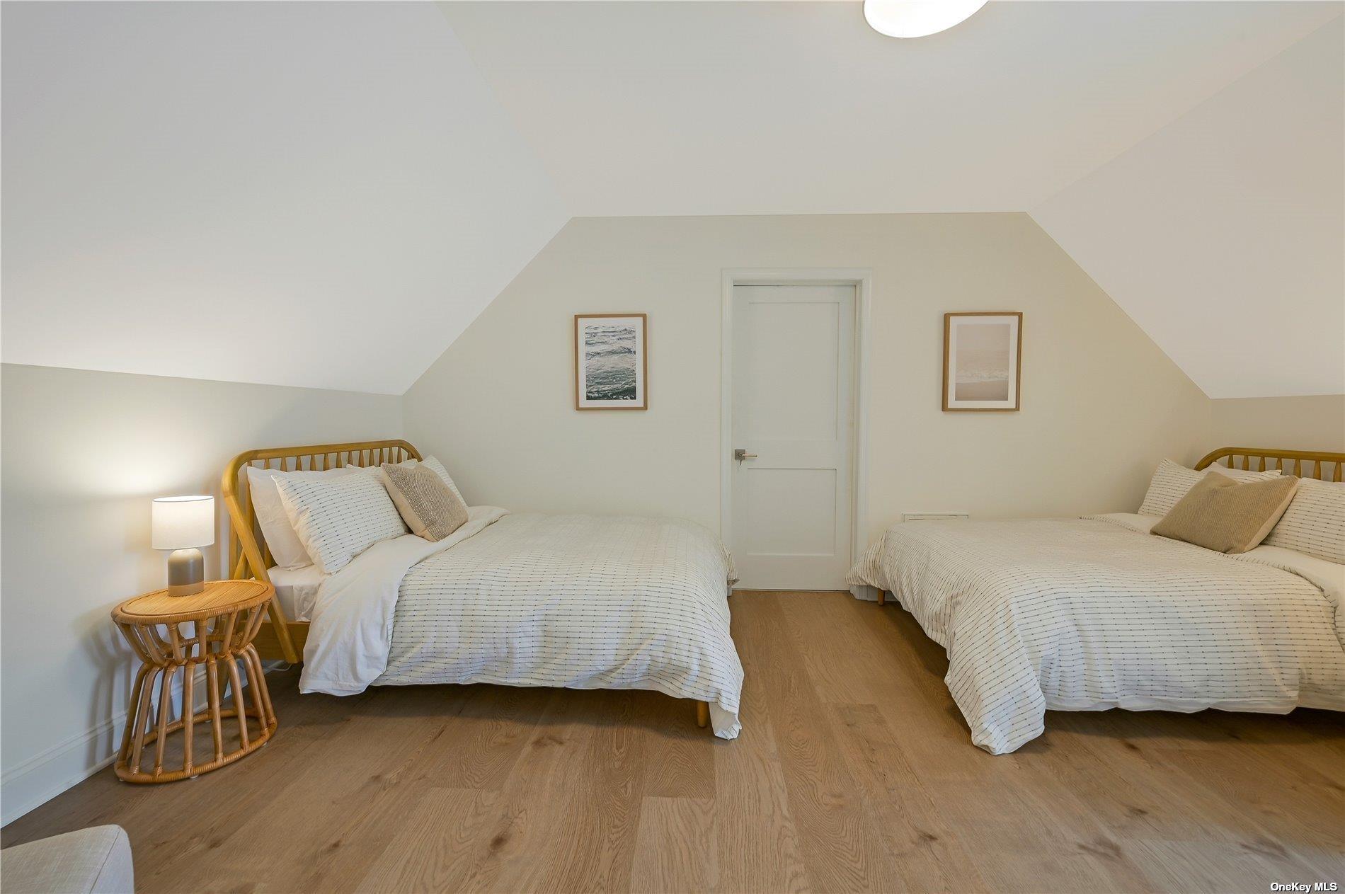 Undisclosed Address Mattituck, NY 11952 - Photo 20 of 35 a bedroom with a bed and a chair