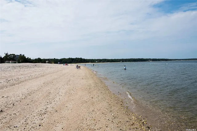 a view of deck with furniture and garden