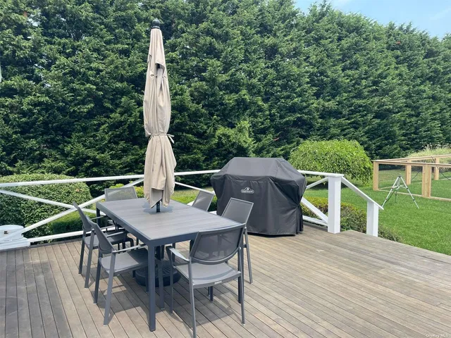 a view of outdoor sitting area with furniture and garden