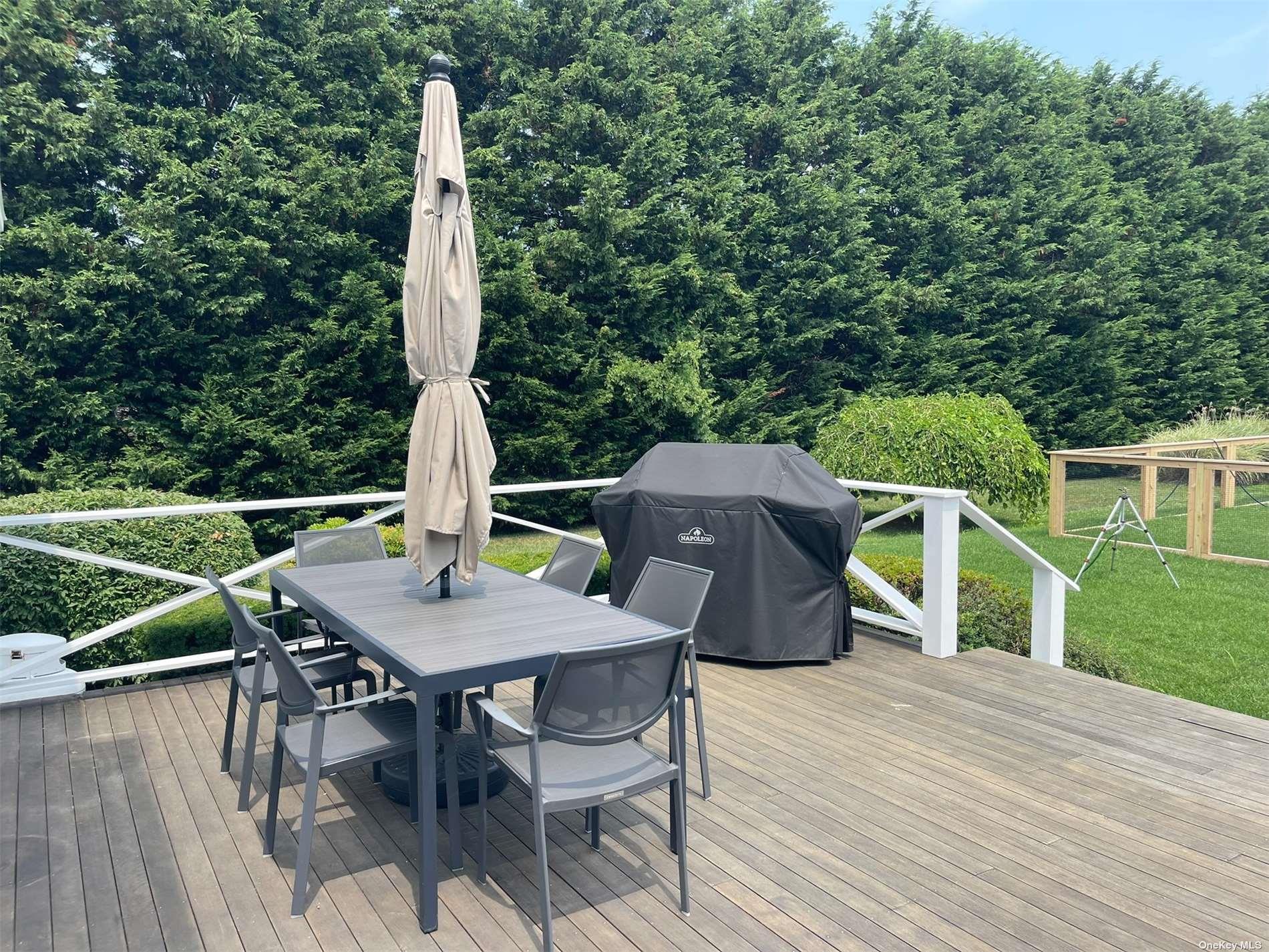 Undisclosed Address Mattituck, NY 11952 - Photo 29 of 35 a view of deck with furniture and garden