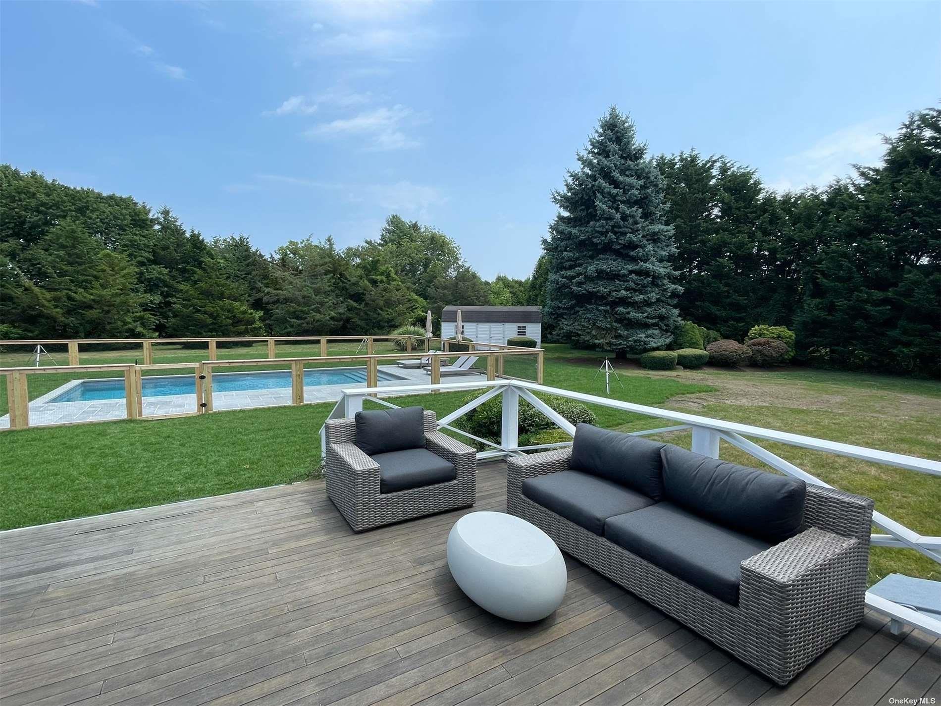 Undisclosed Address Mattituck, NY 11952 - Photo 30 of 35 a view of a patio with couches chairs and a yard