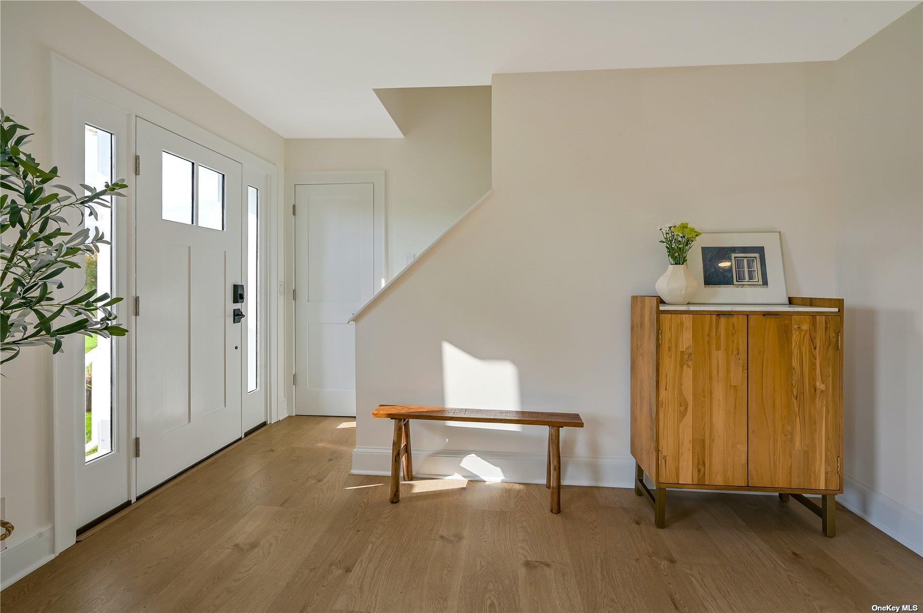 Undisclosed Address Mattituck, NY 11952 - Photo 3 of 35 a view of an entryway with wooden floor