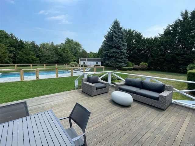 an aerial view of a house with a swimming pool