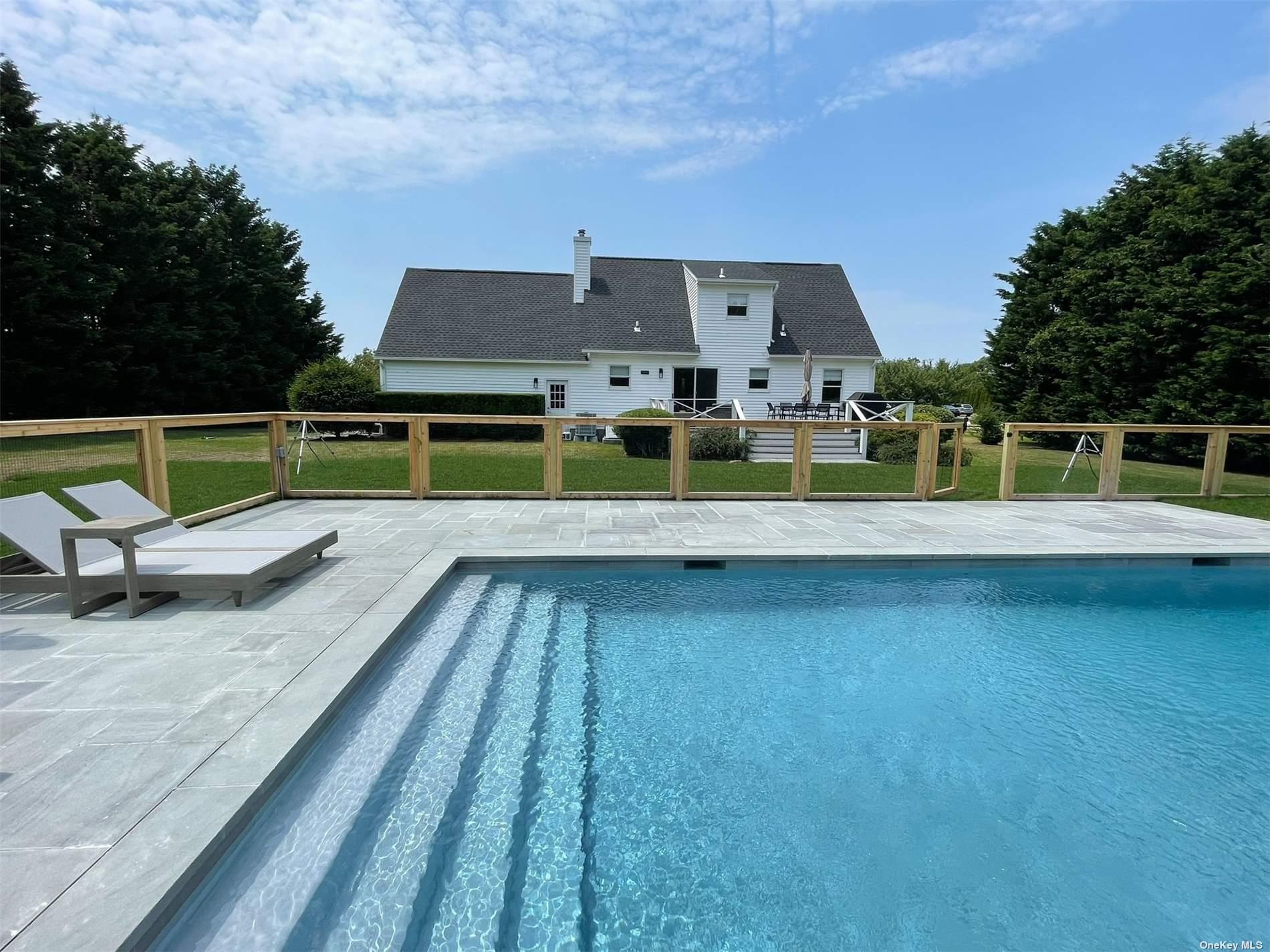 Undisclosed Address Mattituck, NY 11952 - Photo 33 of 35 an aerial view of a house with a swimming pool