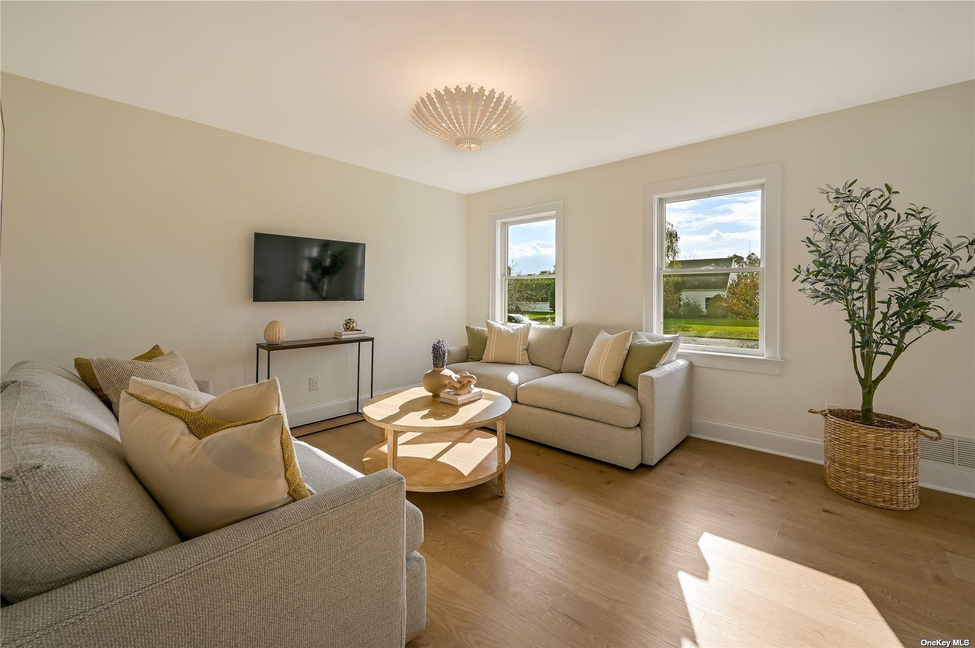Undisclosed Address Mattituck, NY 11952 - Photo 5 of 35 a living room with furniture potted plant and a window