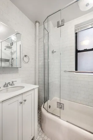 a kitchen with granite countertop a stove and a refrigerator