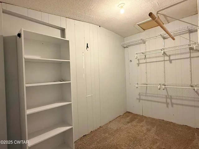 a view of a room with racks on the wall