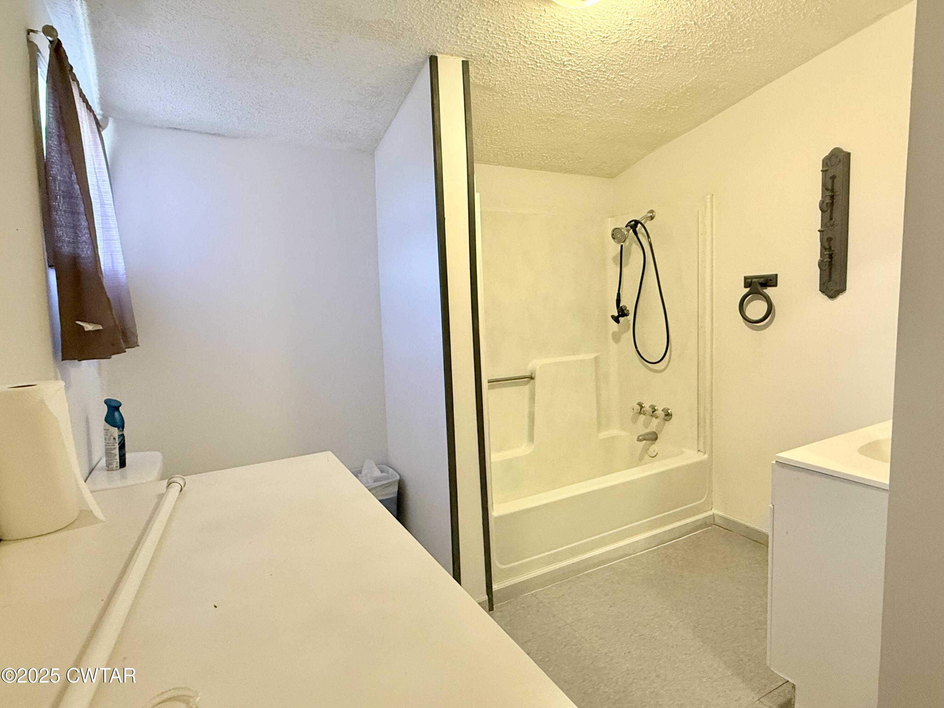4010 Highway 78 Ridgely, TN 38080 - Photo 12 of 21 a bathroom with a tub sink and mirror