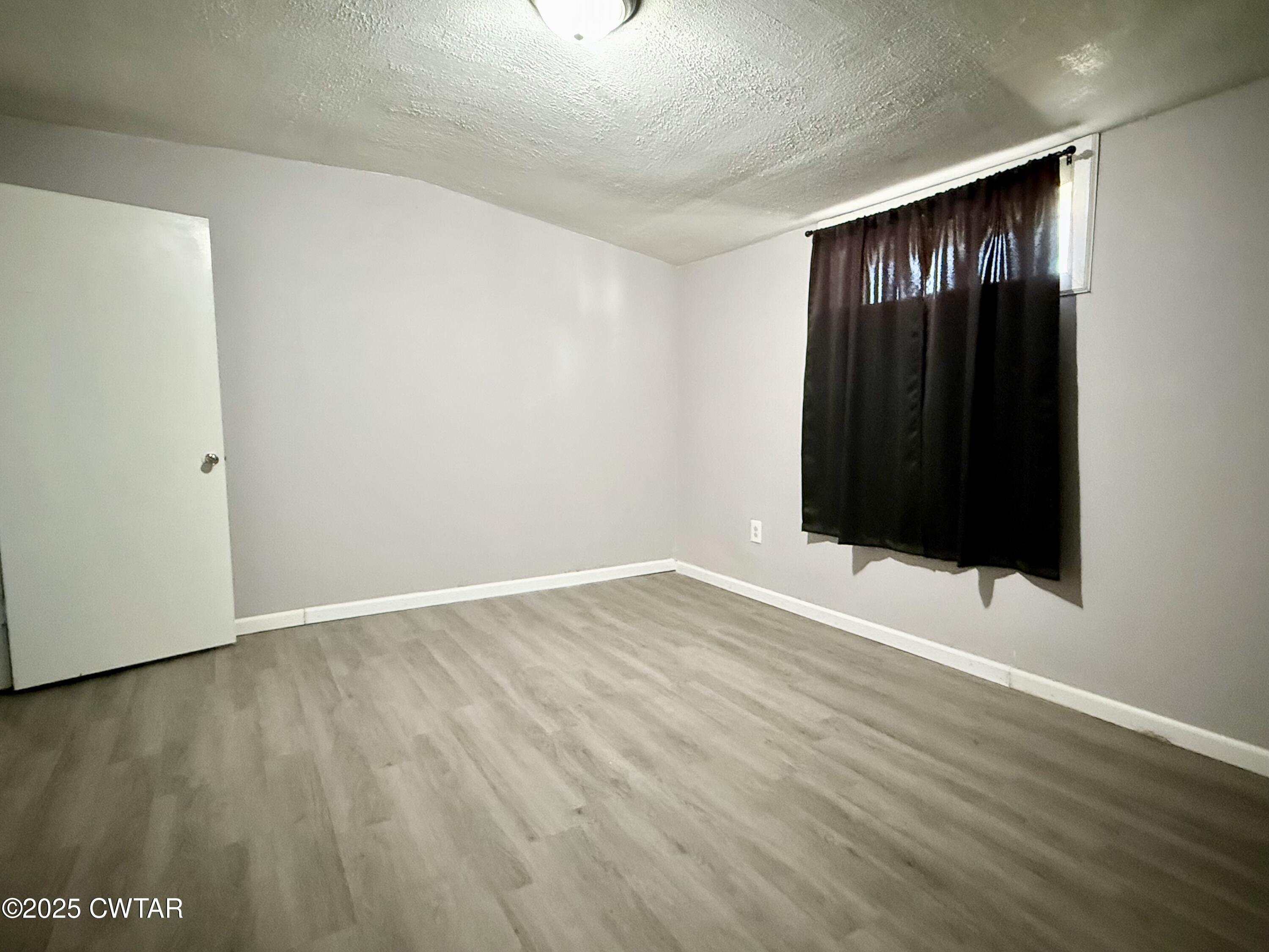 4010 Highway 78 Ridgely, TN 38080 - Photo 14 of 21 a view of an empty room with wooden floor