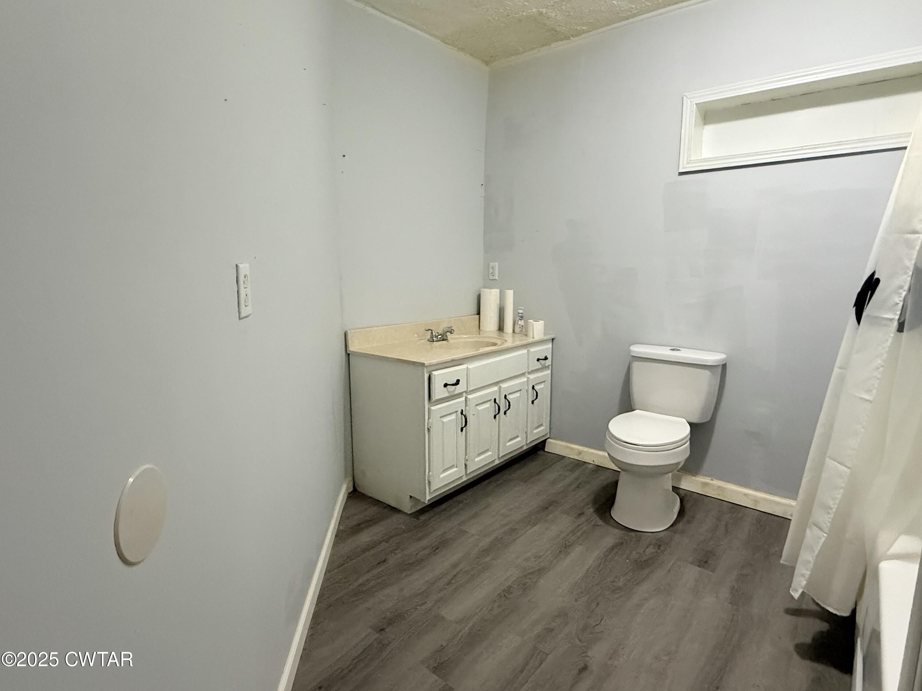 4010 Highway 78 Ridgely, TN 38080 - Photo 16 of 21 a white toilet sitting next to a bathroom sink