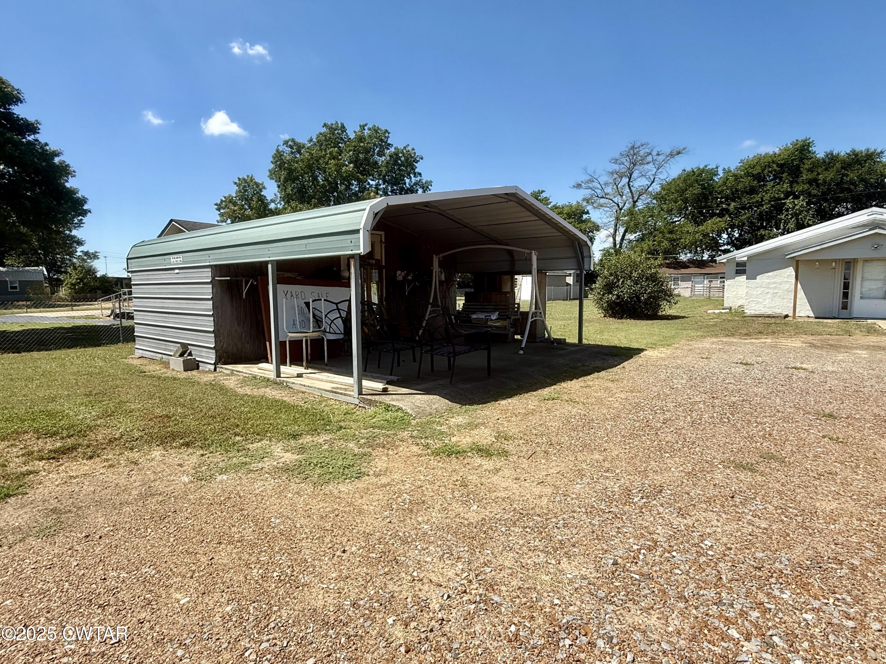 4010 Highway 78 Ridgely, TN 38080 - Photo 21 of 21 a front view of a house with a yard and garage