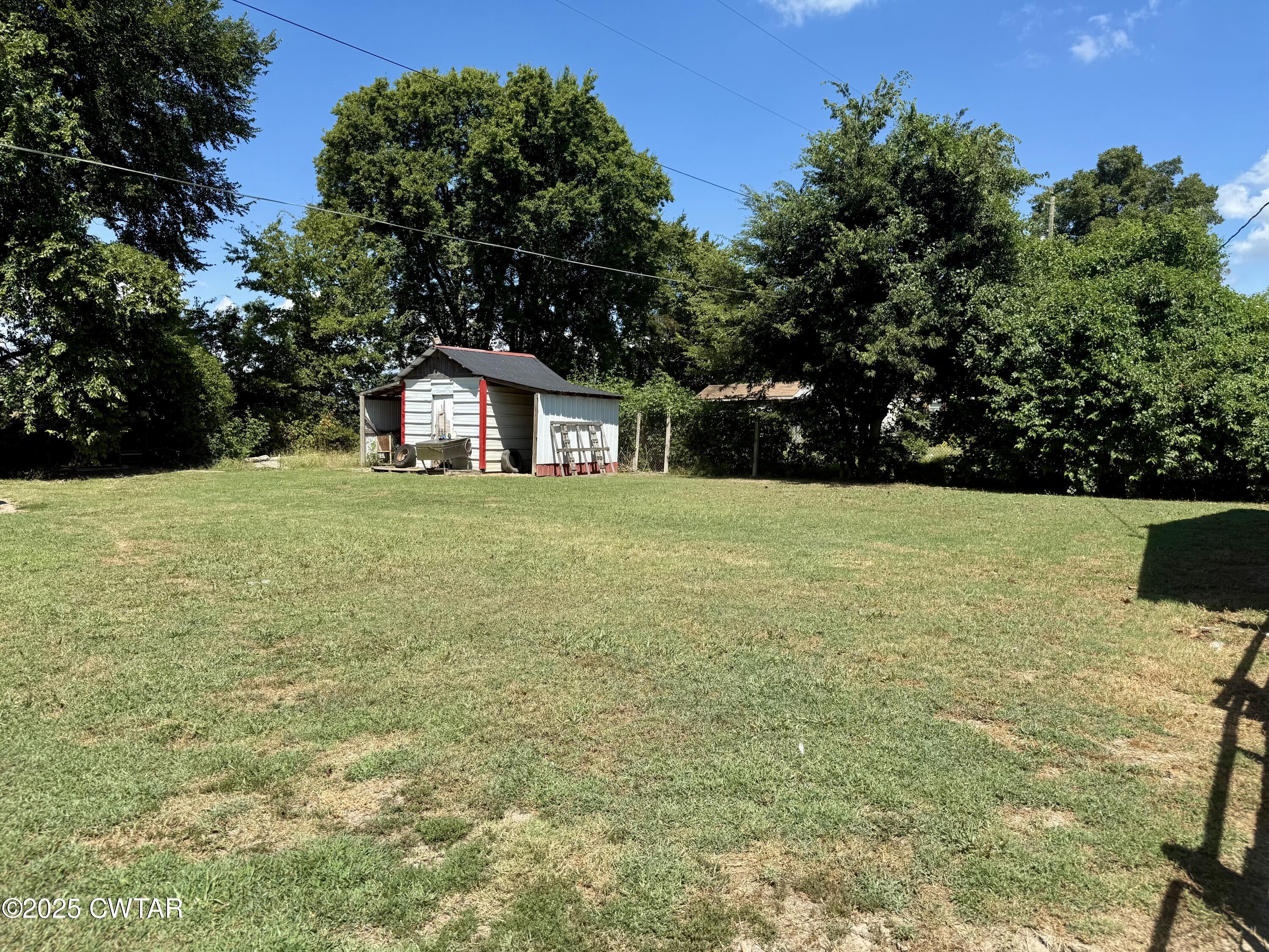 4010 Highway 78 Ridgely, TN 38080 - Photo 3 of 21 a view of a large garden with plants and large trees