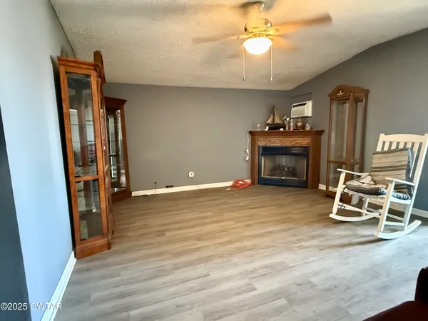 a view of a livingroom with furniture and a fireplace