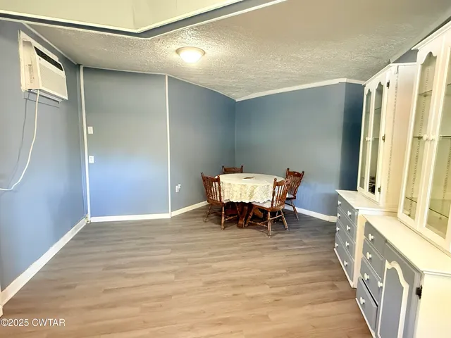 a dining room with furniture and a table