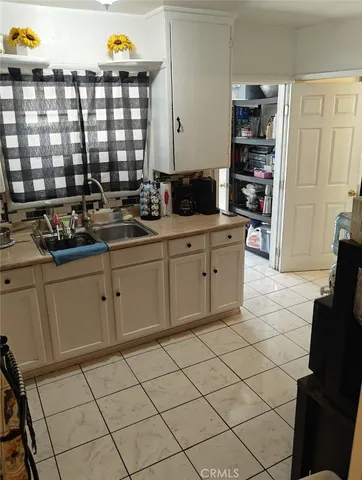 a kitchen with stainless steel appliances a sink and cabinets