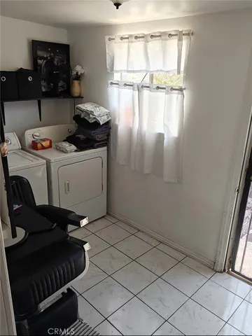 a kitchen with a refrigerator and cabinets