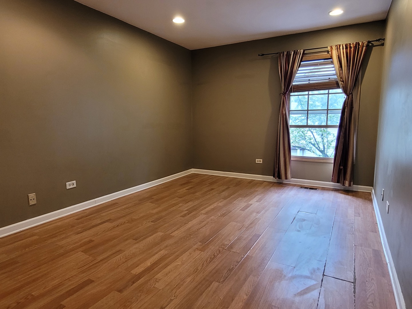 306 Inverrary Lane Deerfield, IL 60015 - Photo 13 of 23 an empty room with wooden floor and windows