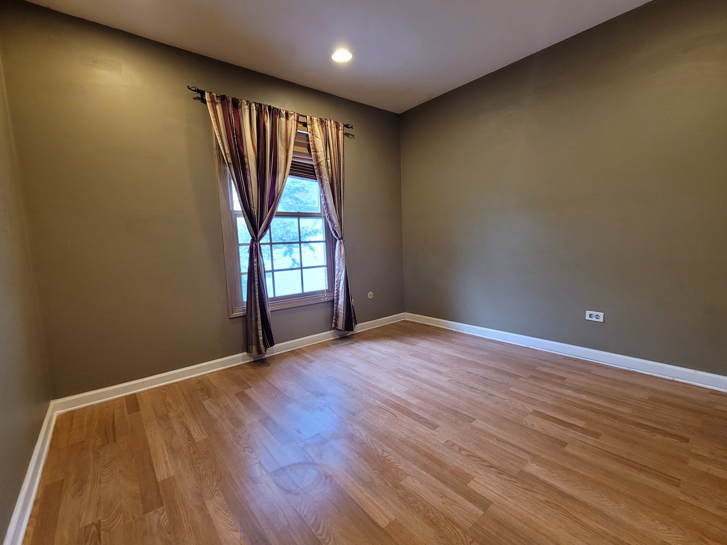 306 Inverrary Lane Deerfield, IL 60015 - Photo 15 of 23 an empty room with wooden floor and windows