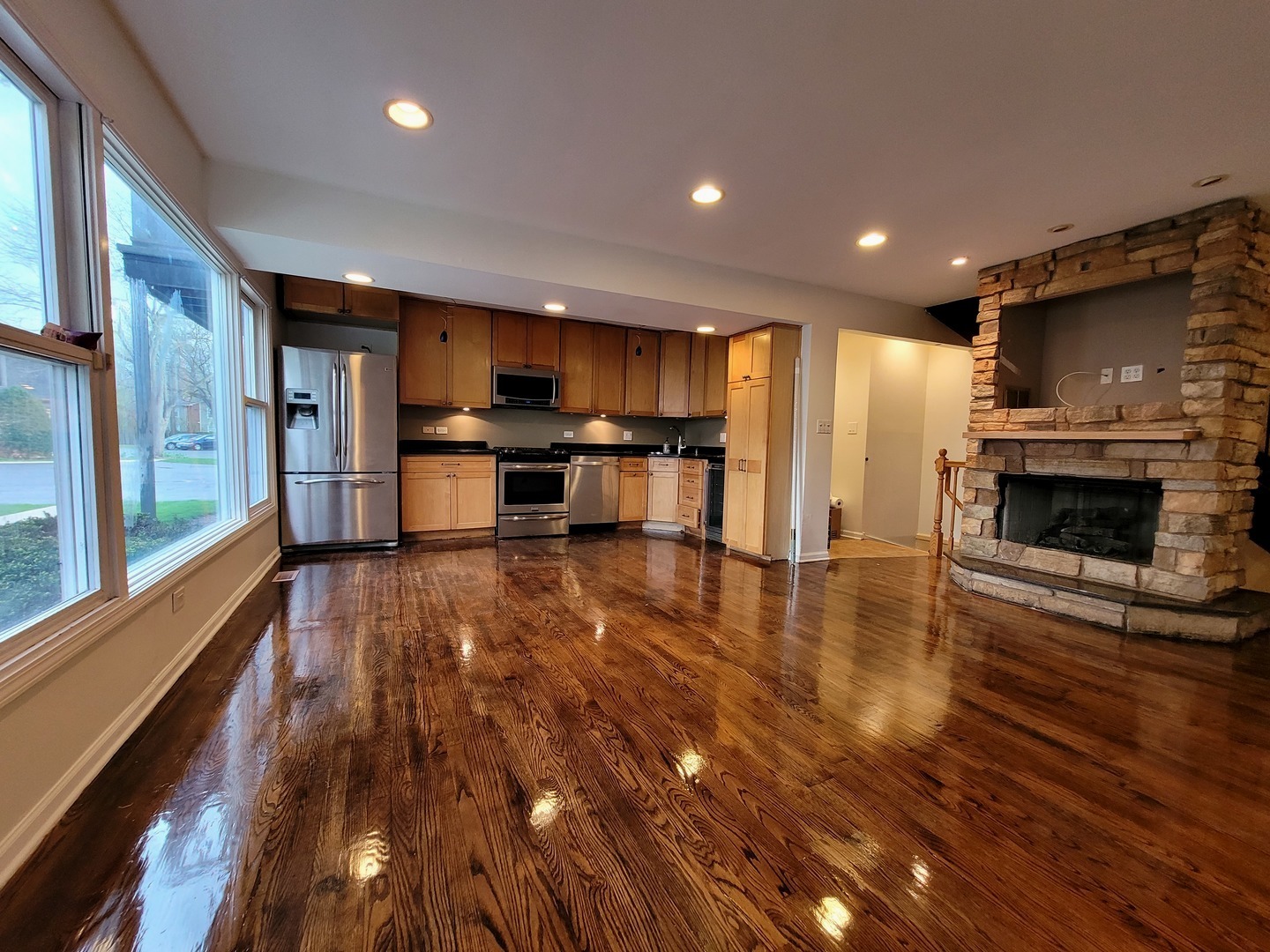306 Inverrary Lane Deerfield, IL 60015 - Photo 5 of 23 a kitchen with stainless steel appliances wooden floor and a refrigerator