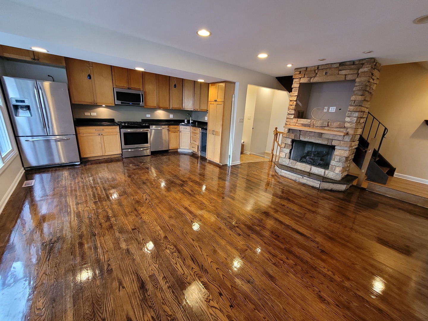 306 Inverrary Lane Deerfield, IL 60015 - Photo 6 of 23 a kitchen with stainless steel appliances wooden floor and a refrigerator