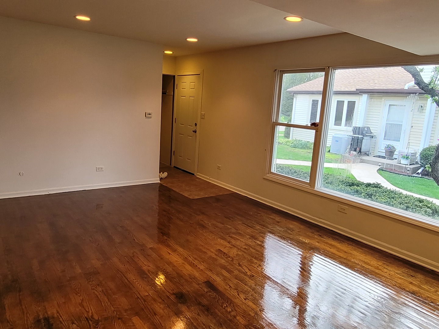 306 Inverrary Lane Deerfield, IL 60015 - Photo 10 of 23 a view of an empty room with wooden floor and a window