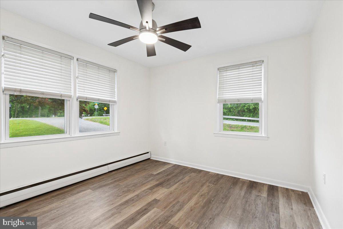 319 Gambrills Road Gambrills, MD 21054 - Photo 24 of 35 an empty room with wooden floor and windows