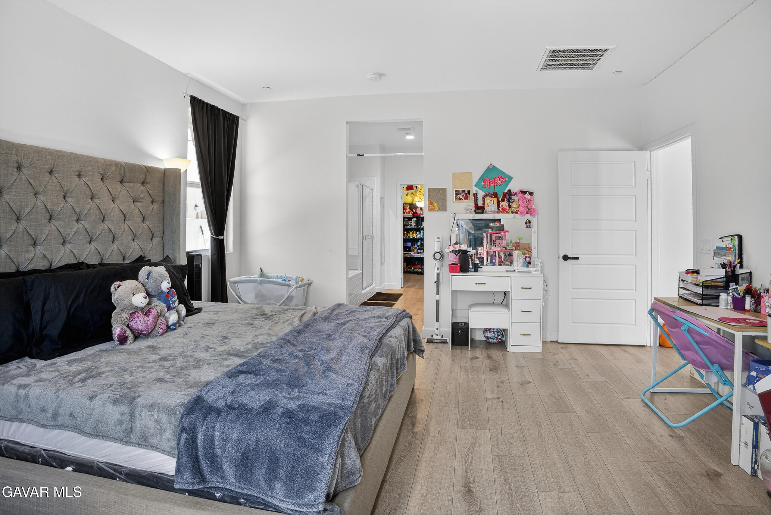 38018 Periwinkle Place Palmdale, CA 93550 - Photo 13 of 32 a bedroom with a bed and a table in it